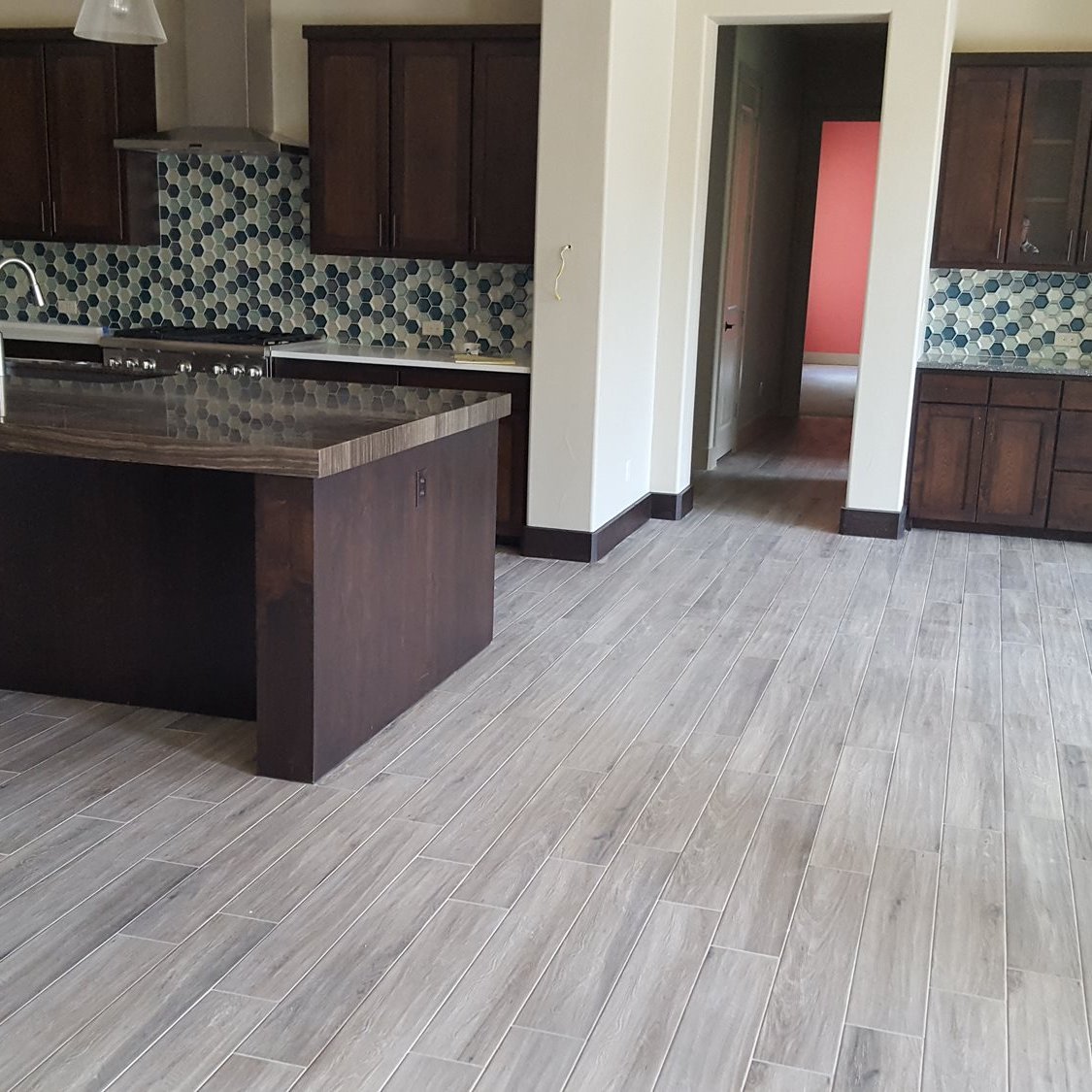 gray laminate floor by Green Carpet Co. - The Flooring Connection in San Antonio, TX