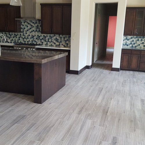gray tile floor by Green Carpet Co. - The Flooring Connection in San Antonio, TX